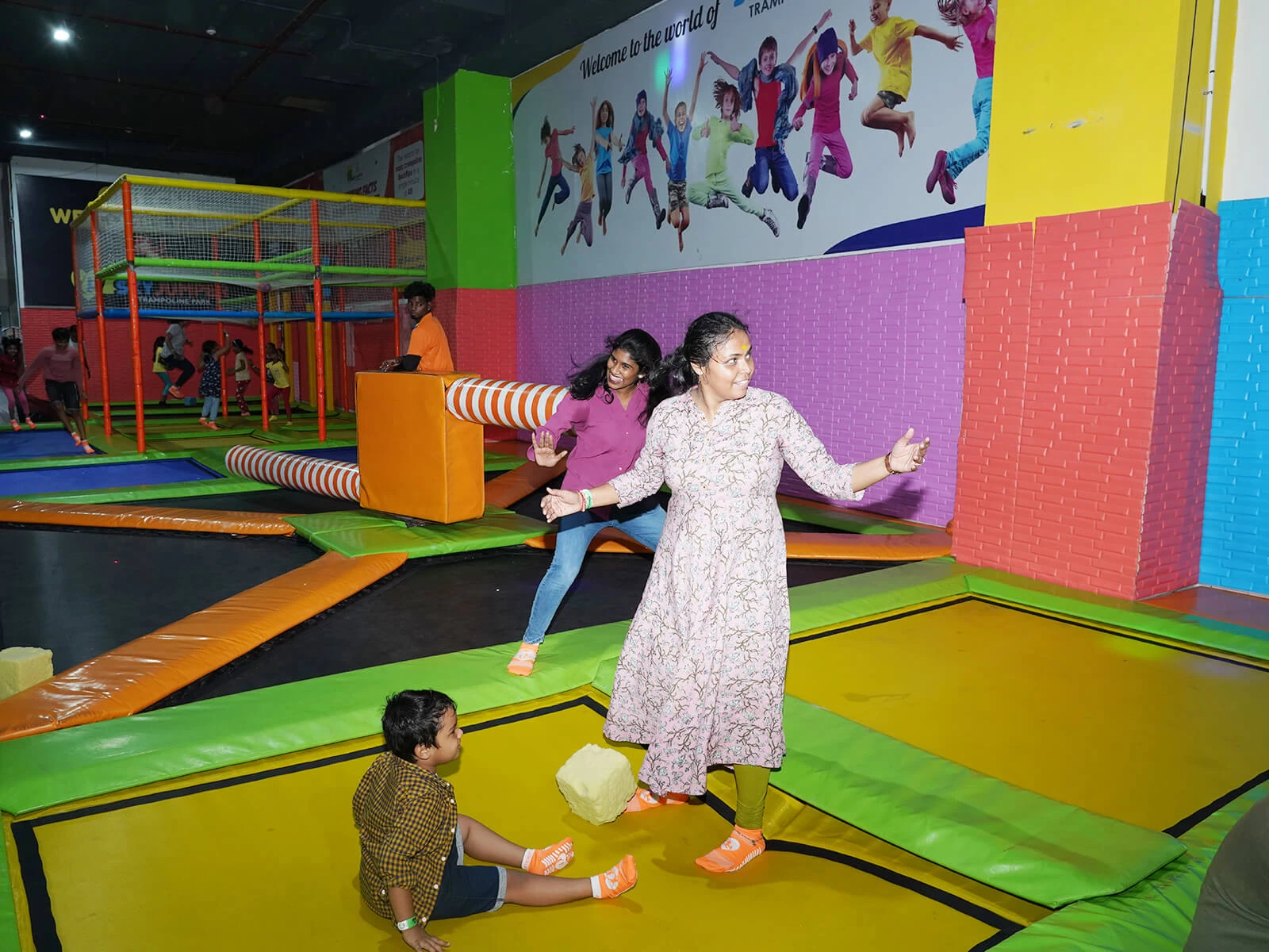 people enjoying in trampoline arena
