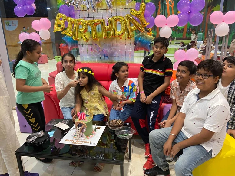 kids posing together during cake cutting at skyjumper