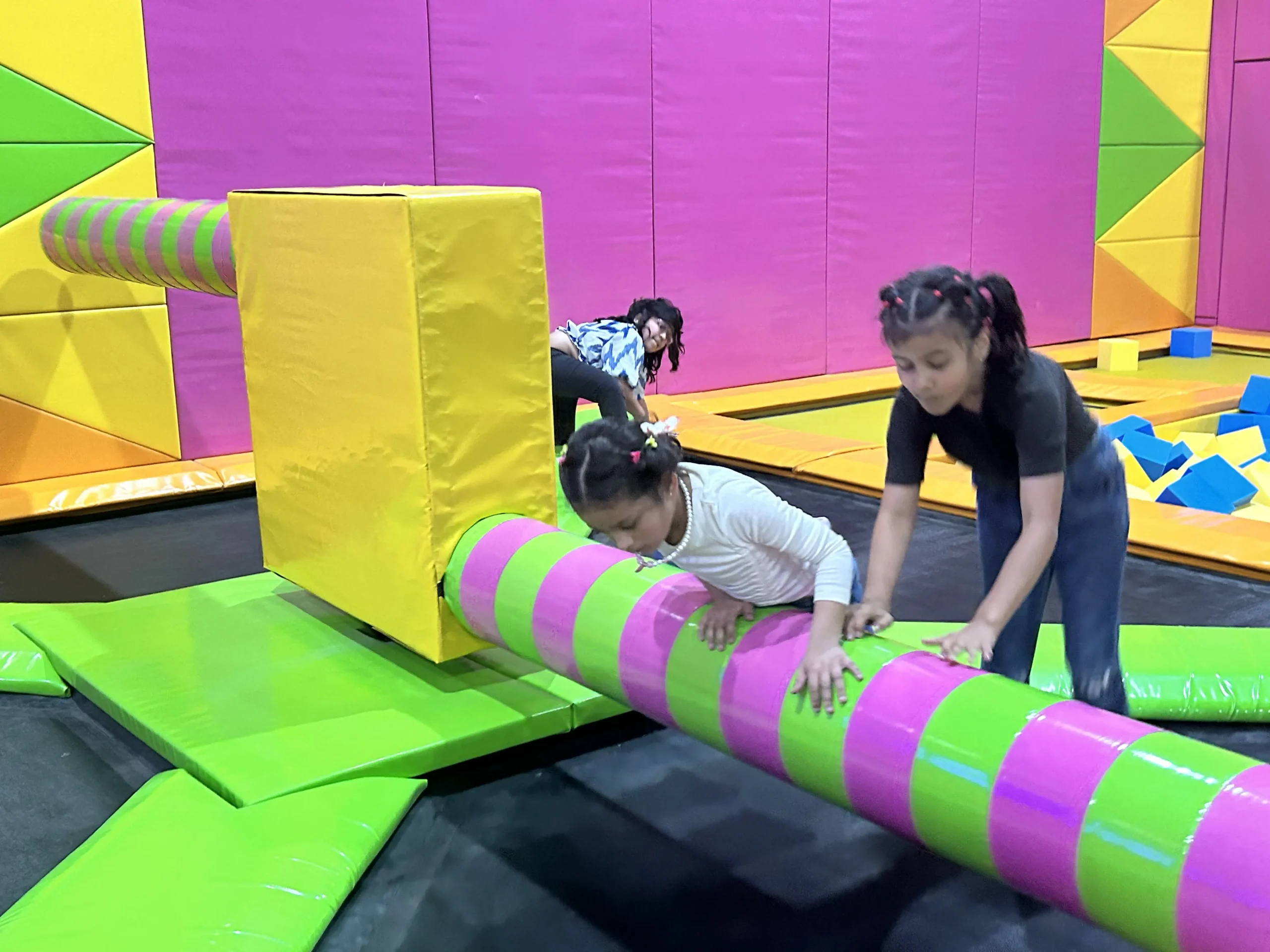 kids playing wipe out at skyjumper