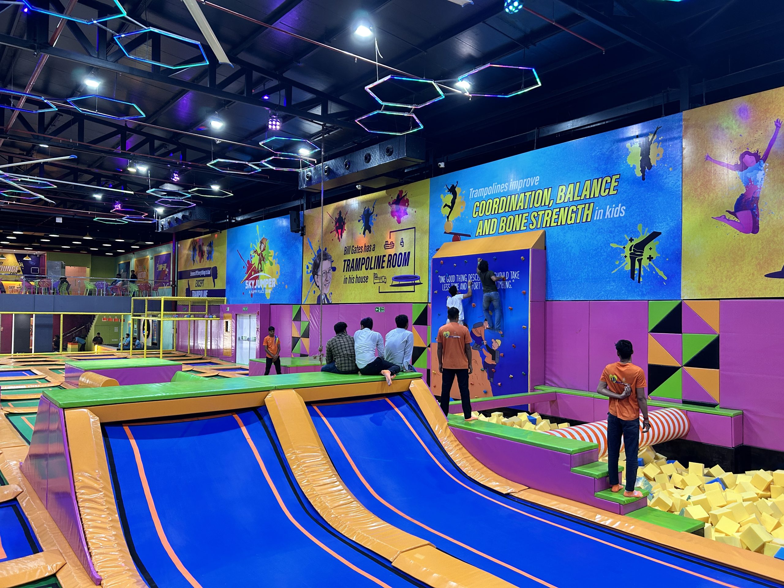 people enjoying in trampoline arena